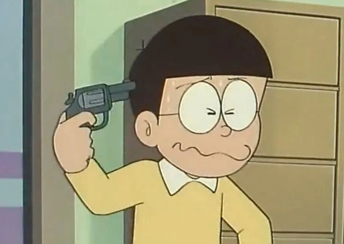 Meme ⚡ Nobita cầm súng chĩa vào đầu mình